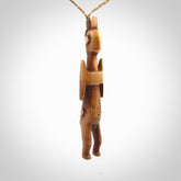 POKERFACE - a traditional Gambier Island figurine, carved as a pendant. This piece was hand carved for us by Yuri Terenyi. This is a work of art and is a collectable piece of traditional bone carving. It can be worn as a special piece of jewellery or displayed. This is art made to wear at its finest.